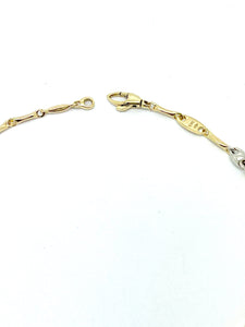 Pulsera tubular bicolor en oro de 18kt con inserciones de malla marina 72084